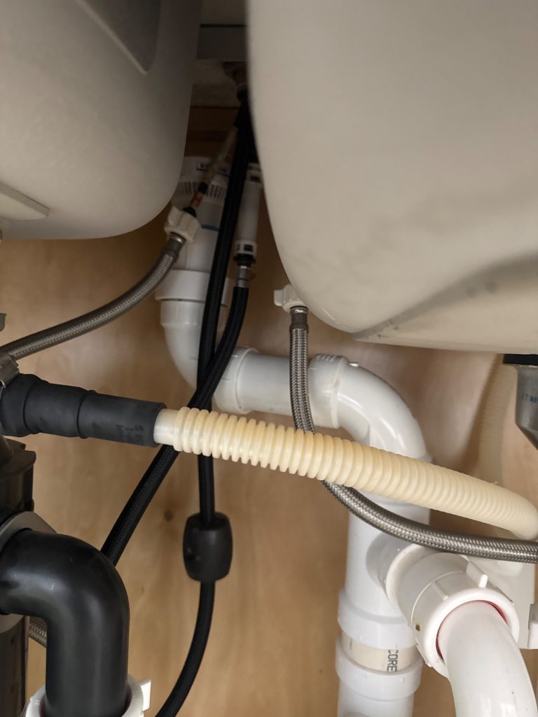 Repaired drain line under kitchen sink at home in Applewood Farms in Taylorsville, GA -- Taylorsville, GA